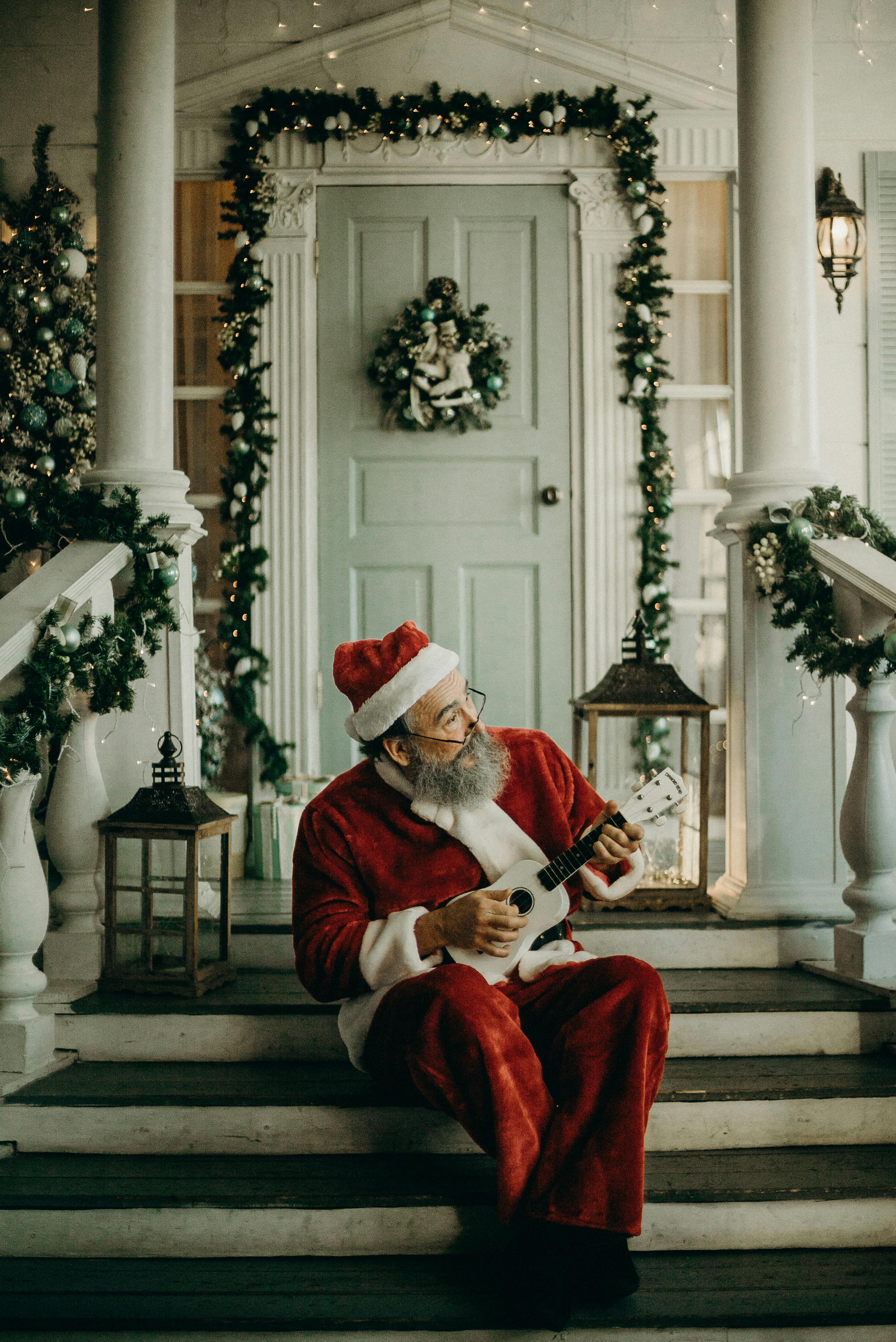 Santa Claus Playing Ukulele on Christmas Porch