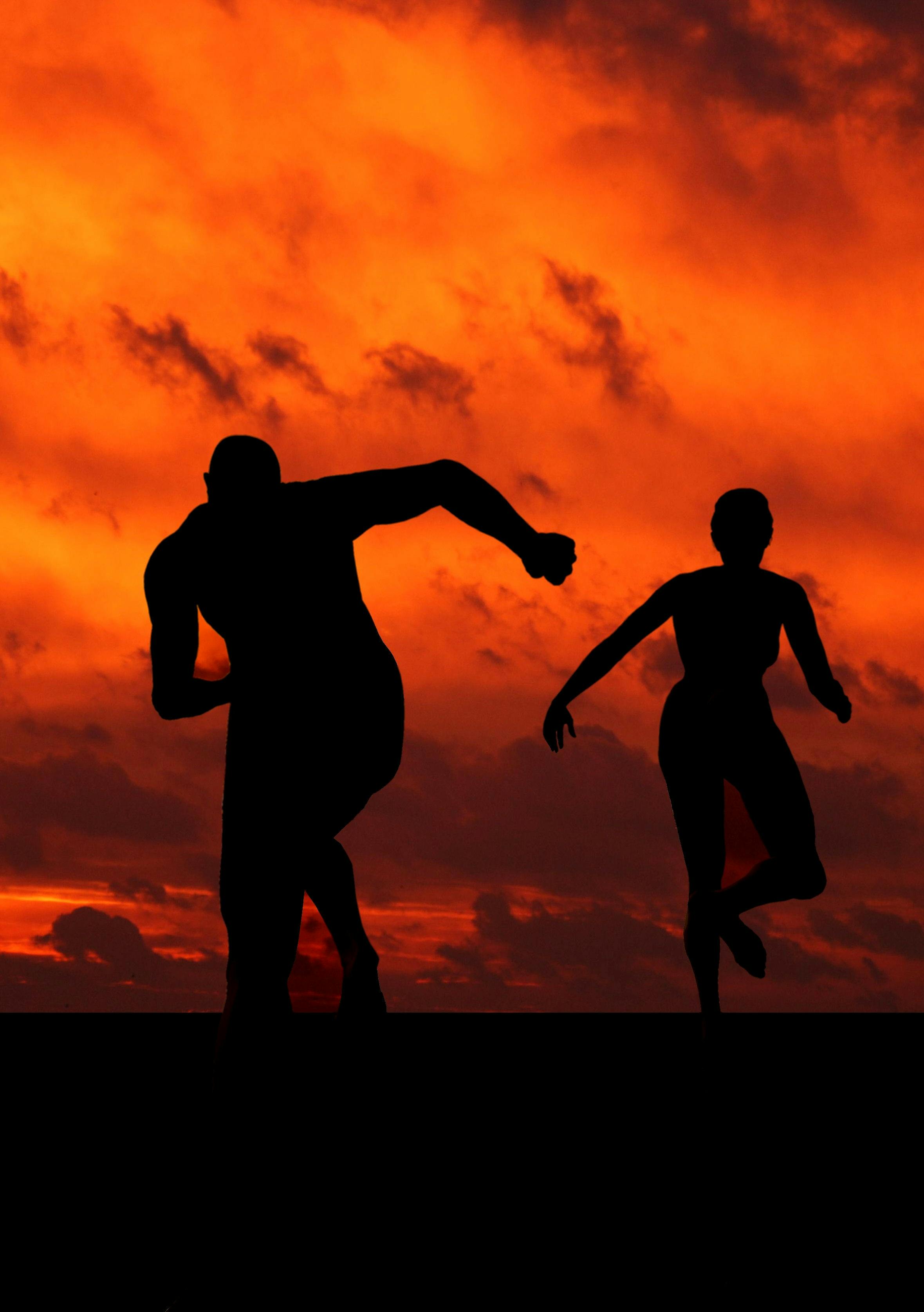 Silhouette Runners at Sunset