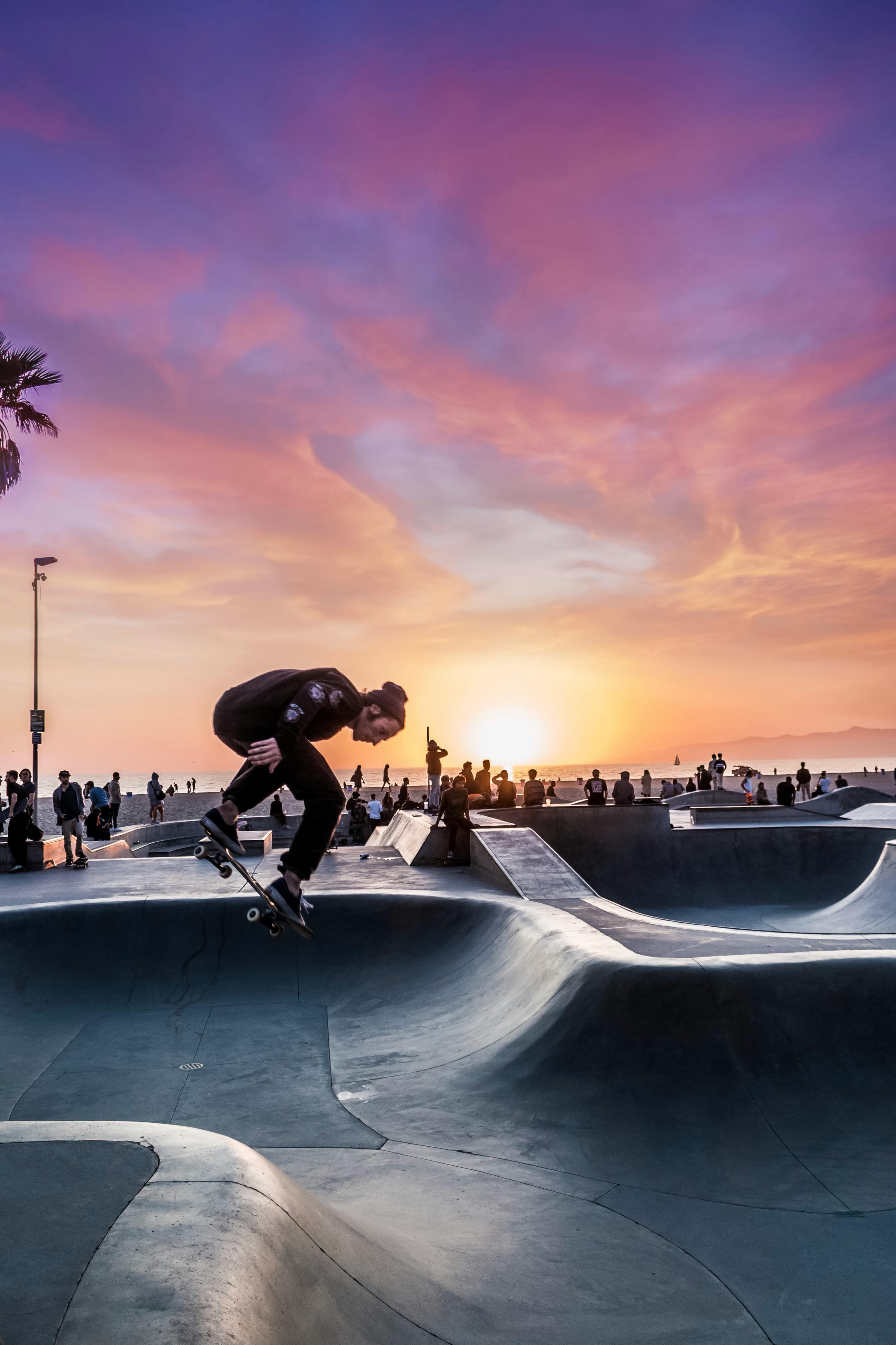 Skateboarder at Sunset in Urban Skatepark
