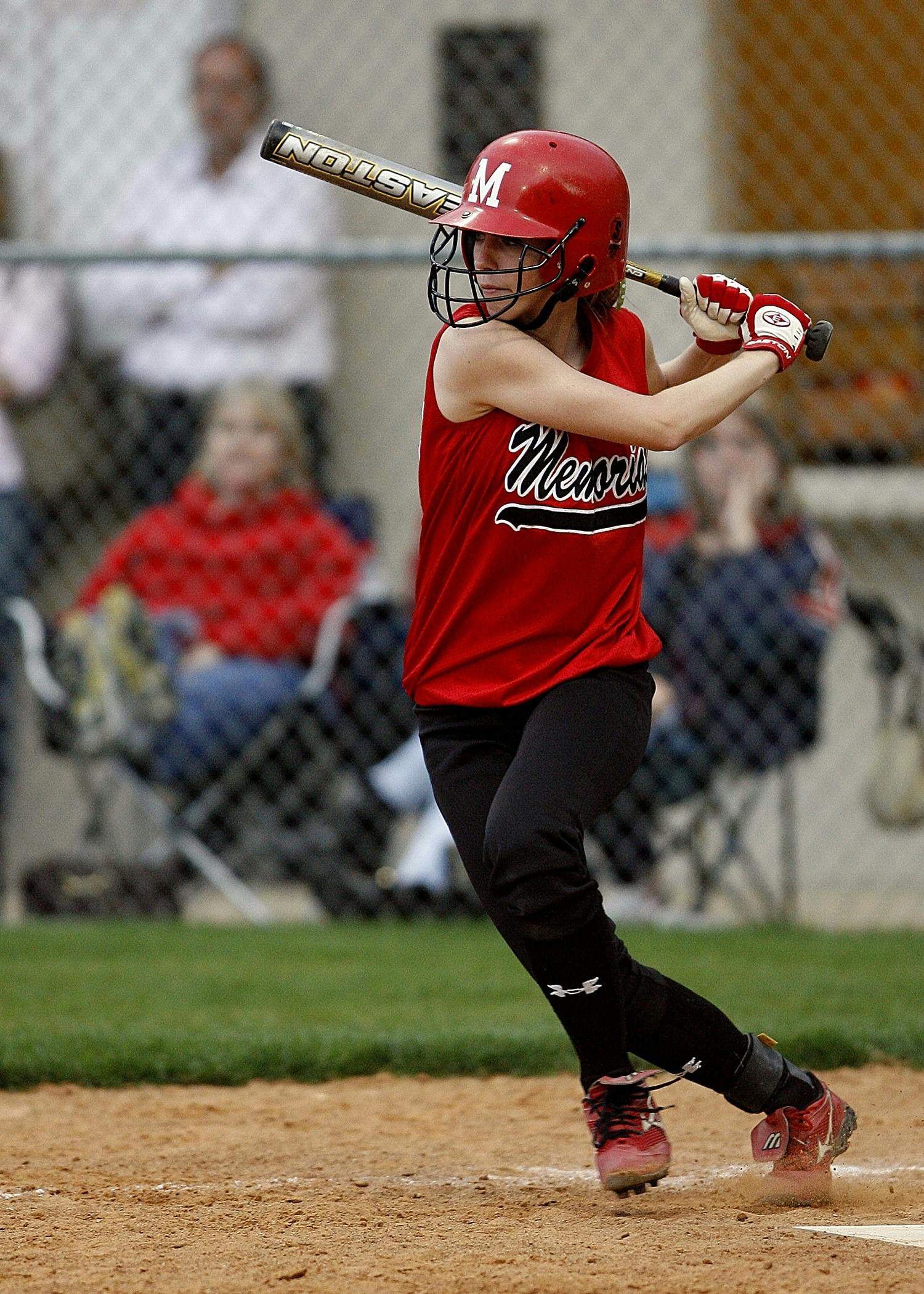 Youth Softball Player Batting